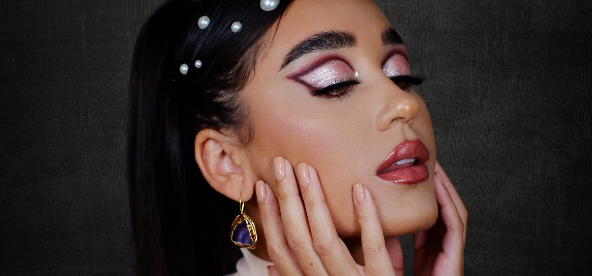 Image fo makeup by Gia MUA | Woman with pink eyeshadow 1960s makeup style.